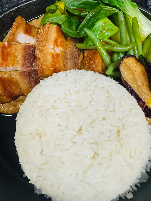 Bagnet Kare-Kare — crispy pork belly in peanut curry at Jeepney Winnipeg